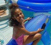 Kayle tries to ride a dolphin (I don't know if it's Phin or Zhaan